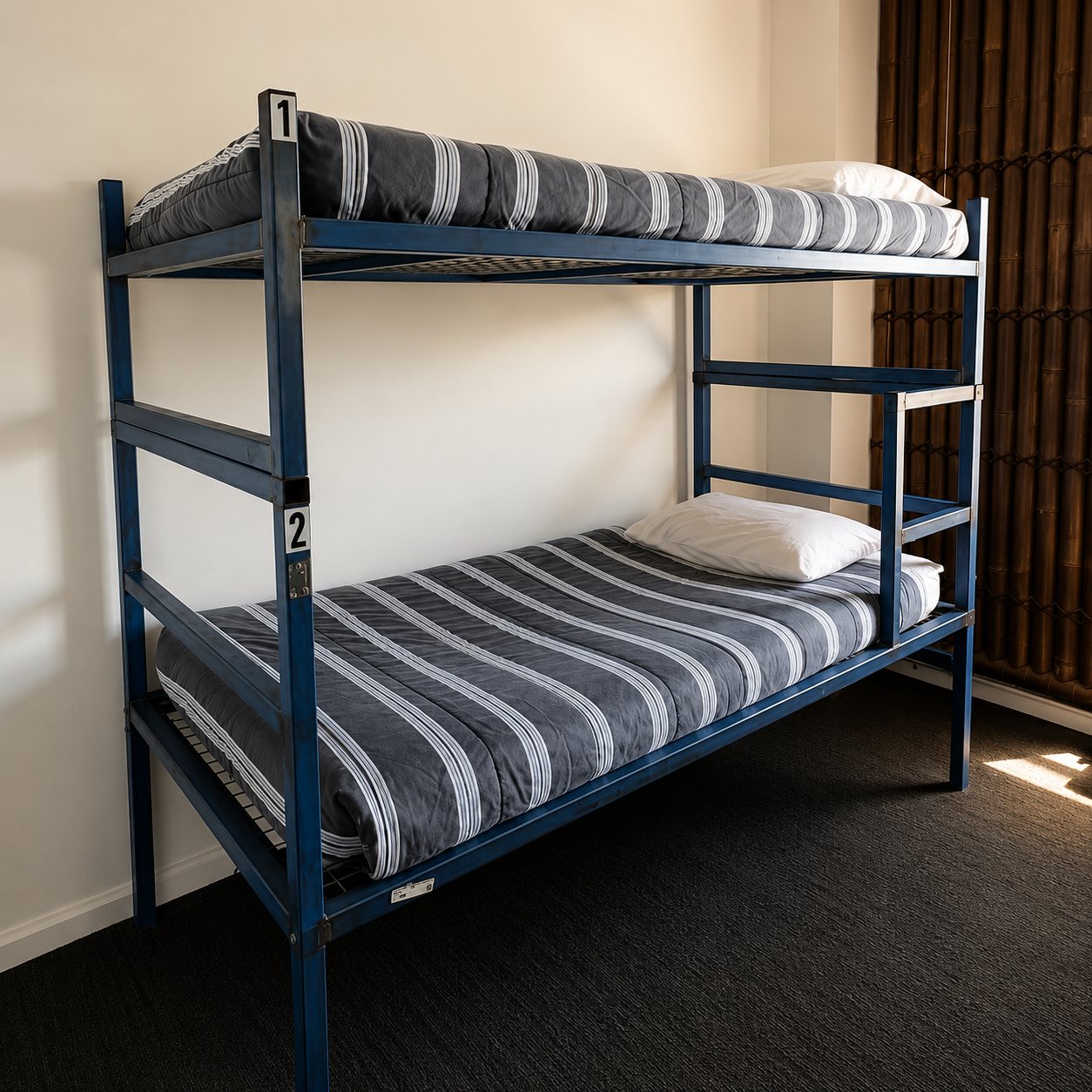 The original steel bunks at Bayside House, before the fitout
